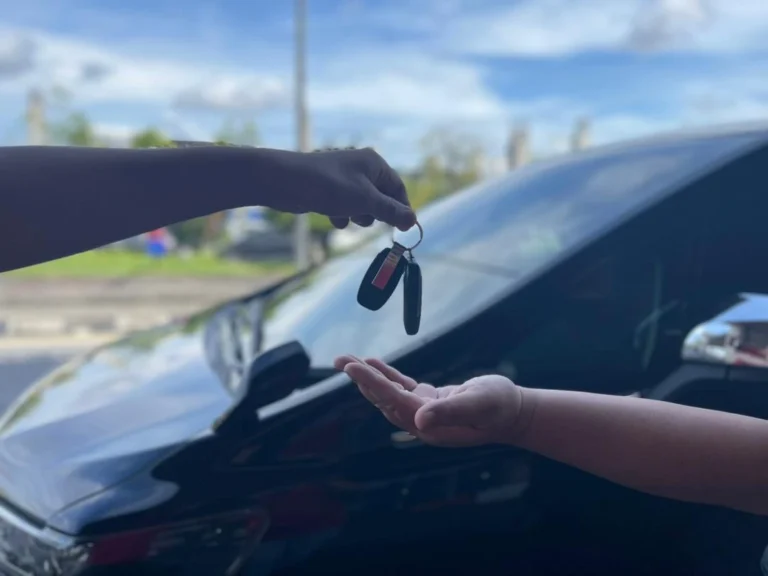 car rental key handover in Kuching for tourists collecting rental car
